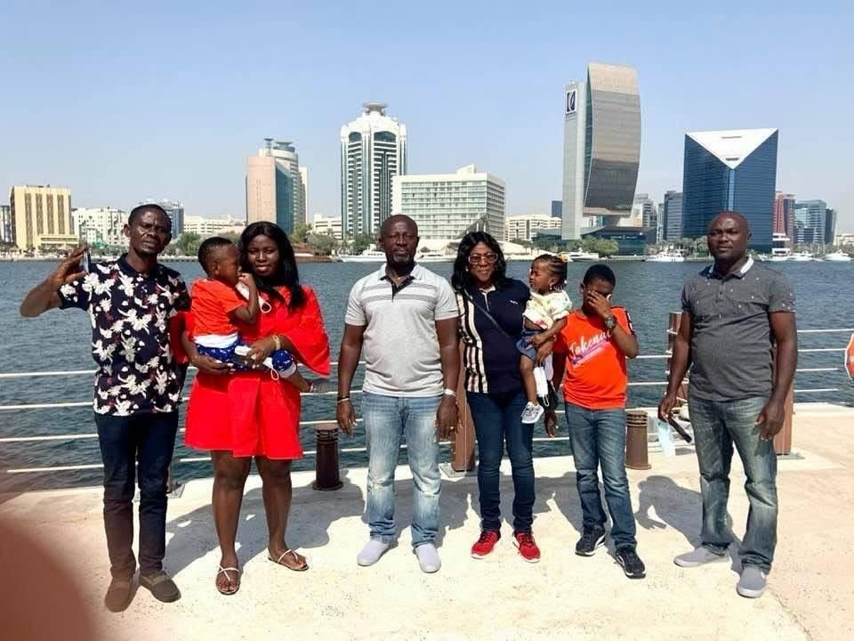 PAK Travels family group with the Dubai Marina skyline